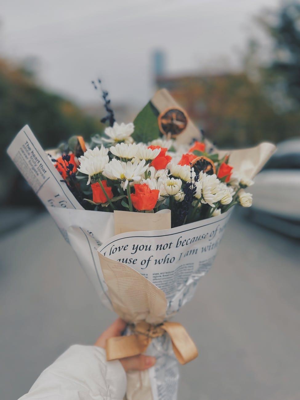 artistic bouquet with newspaper wrap outdoors